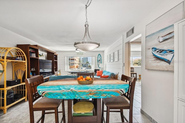 dining area featuring light tile patterned floors