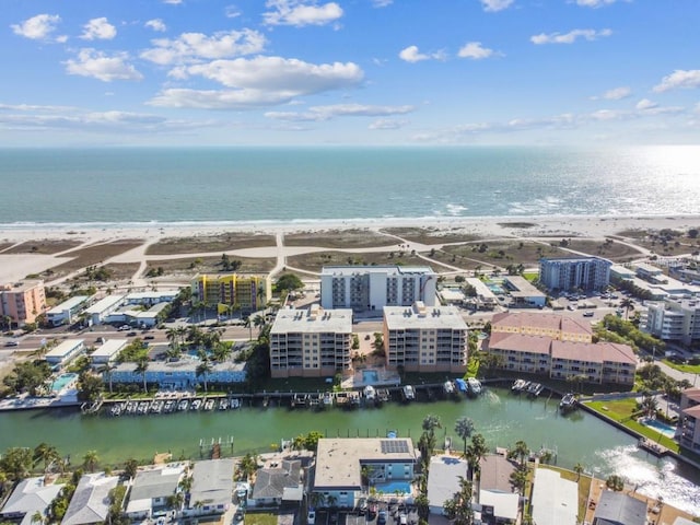 bird's eye view with a beach view and a water view