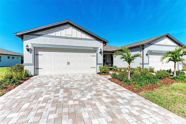 single story home featuring a garage