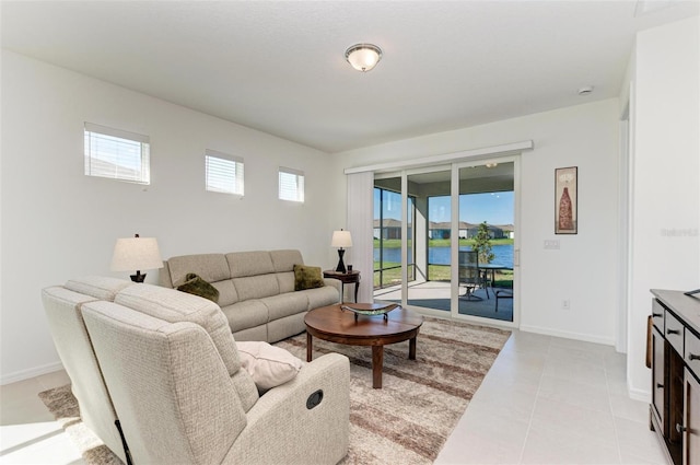 tiled living room with a water view