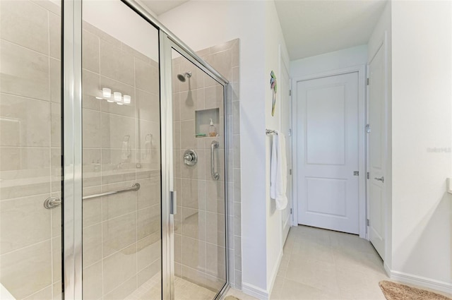 bathroom featuring tile patterned floors and walk in shower