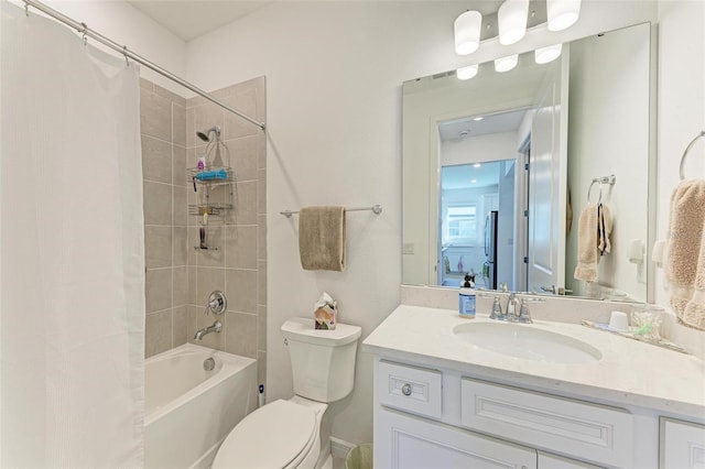 full bathroom with toilet, vanity, and shower / tub combo