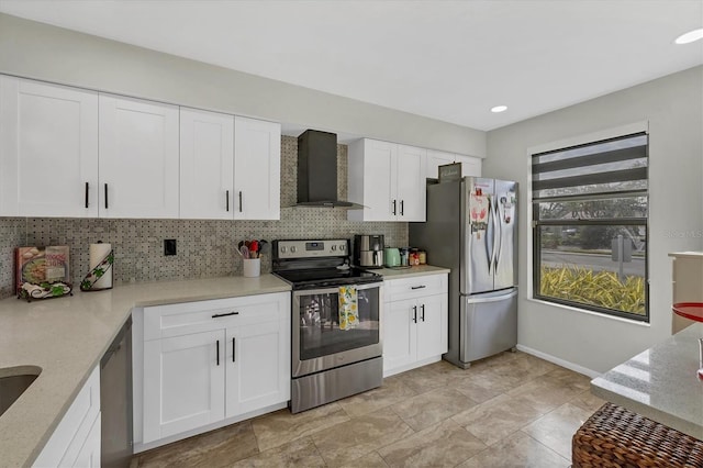 kitchen with white cabinets, wall chimney exhaust hood, backsplash, and stainless steel appliances