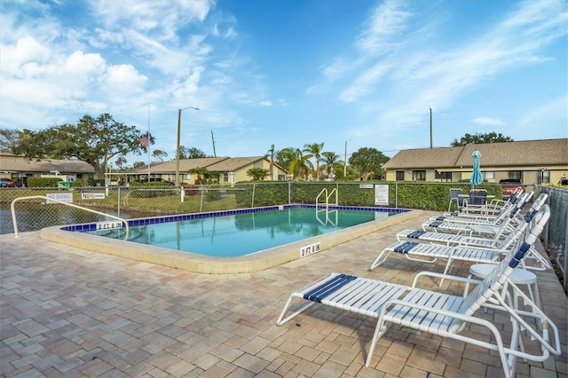 view of swimming pool with a patio area