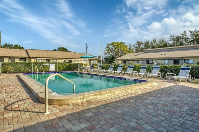 view of swimming pool featuring a patio