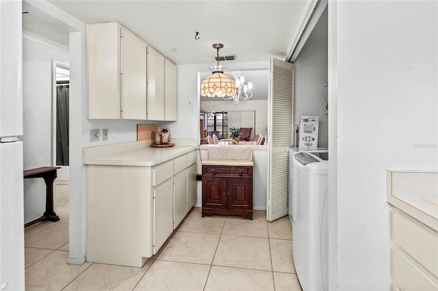 kitchen featuring a notable chandelier, white cabinets, white refrigerator, decorative light fixtures, and washer / clothes dryer