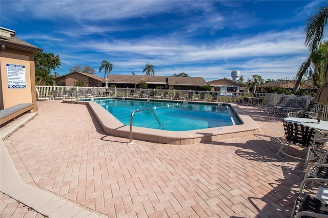 view of swimming pool featuring a patio area