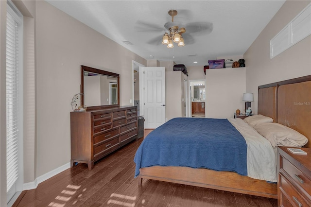 bedroom with ceiling fan, dark hardwood / wood-style floors, and ensuite bathroom