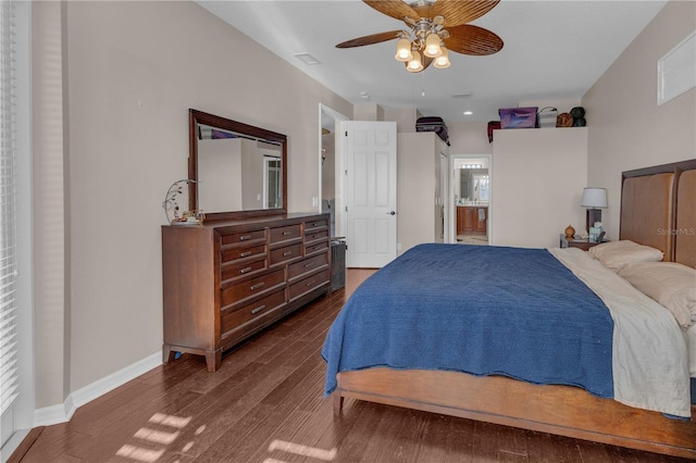 bedroom with ceiling fan, dark hardwood / wood-style floors, and ensuite bathroom