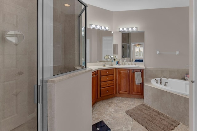 bathroom with vanity, separate shower and tub, and tile patterned floors