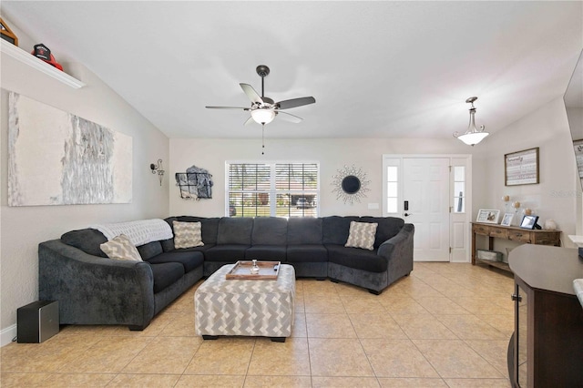 tiled living room featuring vaulted ceiling and ceiling fan