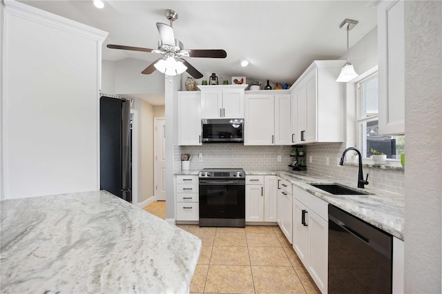 kitchen featuring white cabinetry, sink, pendant lighting, light tile patterned floors, and appliances with stainless steel finishes