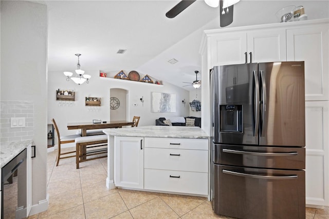 kitchen with white cabinets, light tile patterned flooring, light stone countertops, and stainless steel fridge with ice dispenser