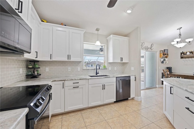 kitchen with stainless steel dishwasher, black range with electric cooktop, sink, white cabinets, and hanging light fixtures