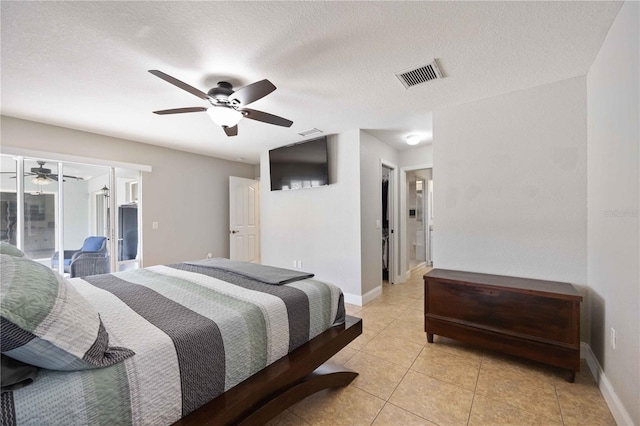 tiled bedroom with access to outside, ceiling fan, and a textured ceiling