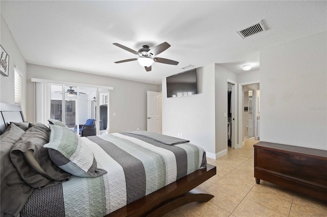 tiled bedroom with access to outside, connected bathroom, ceiling fan, and a textured ceiling