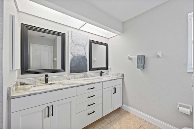 bathroom with tile patterned flooring and vanity