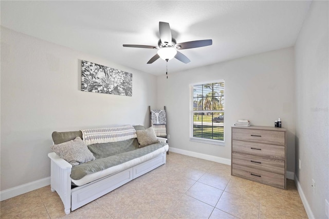 sitting room featuring ceiling fan and light tile patterned floors