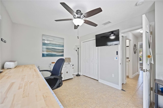 office area featuring ceiling fan and light tile patterned flooring