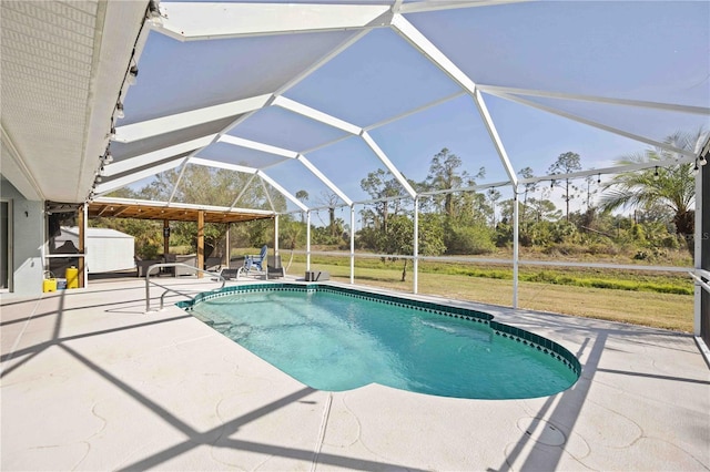 view of swimming pool featuring a lanai and a patio