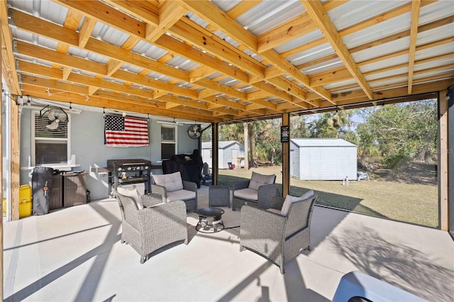 view of patio featuring an outdoor hangout area and a storage shed