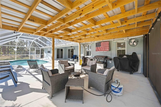 view of patio / terrace featuring glass enclosure, ceiling fan, and an outdoor hangout area