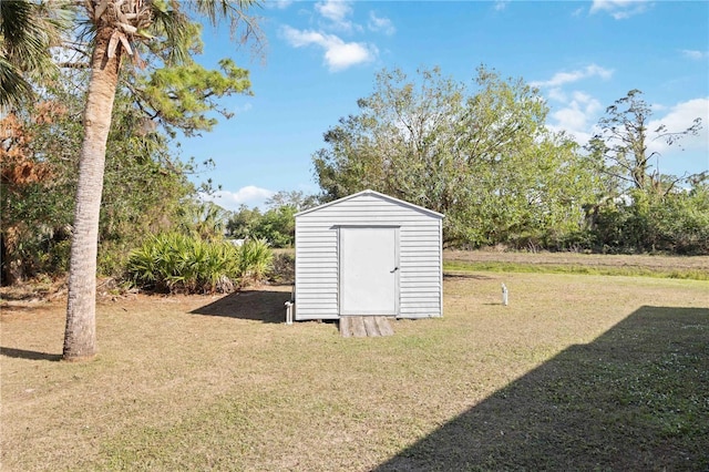 view of outdoor structure with a lawn