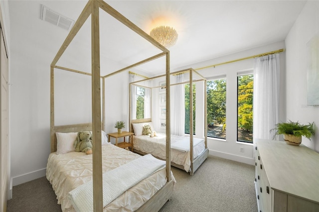 bedroom with light colored carpet