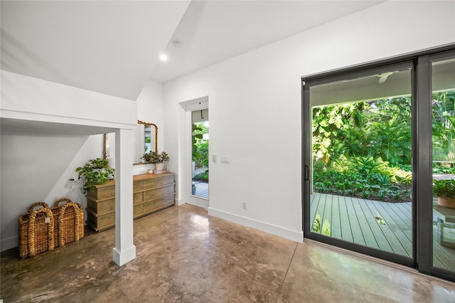 entryway featuring concrete floors and a healthy amount of sunlight