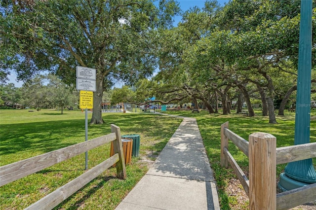 view of property's community featuring a yard