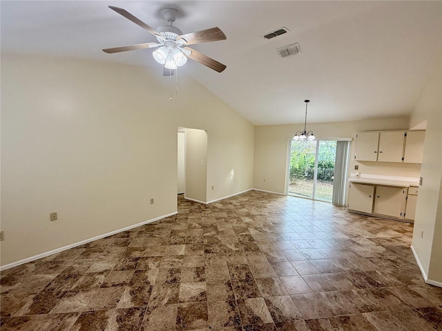 interior space with ceiling fan with notable chandelier and lofted ceiling