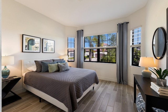 bedroom with hardwood / wood-style floors