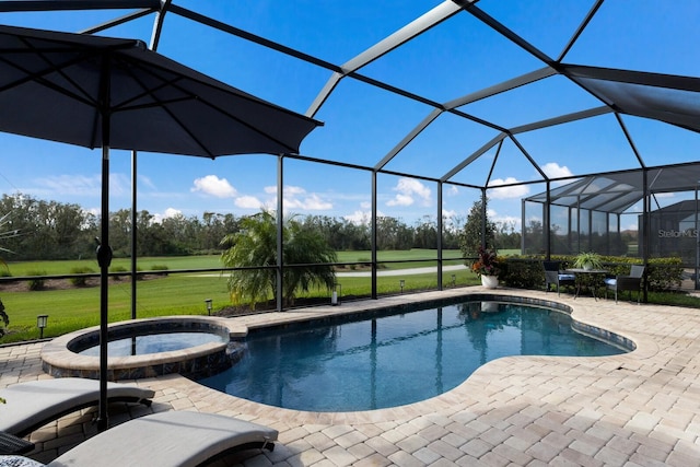 view of pool featuring an in ground hot tub, a yard, glass enclosure, and a patio area