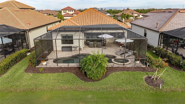 back of property featuring a lawn and a patio