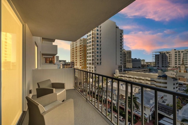 view of balcony at dusk