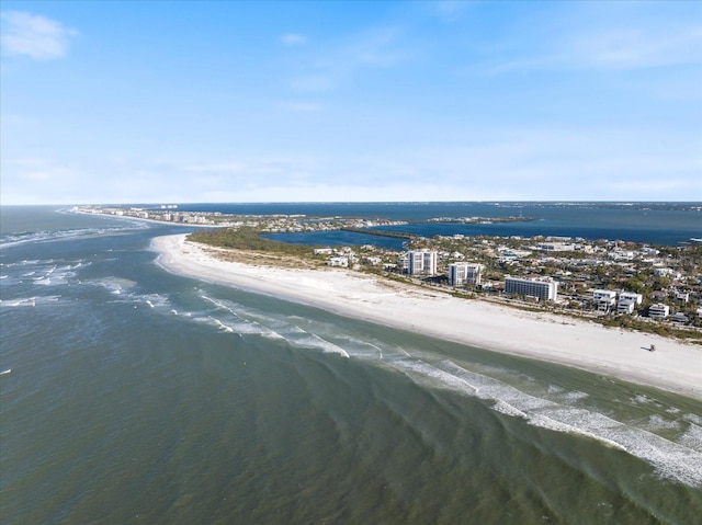 birds eye view of property featuring a beach view and a water view