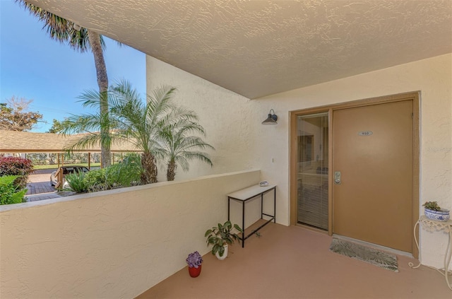 entrance to property with a balcony