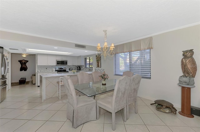 tiled dining room featuring a notable chandelier and crown molding