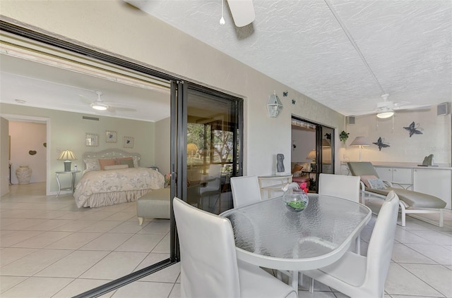 interior space featuring light tile patterned floors and a textured ceiling