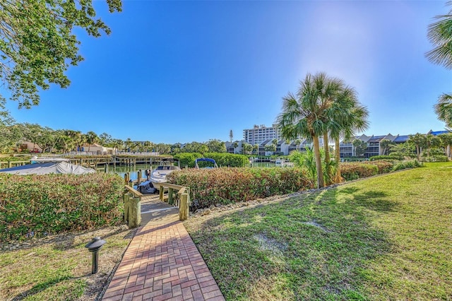 exterior space with a lawn and a water view