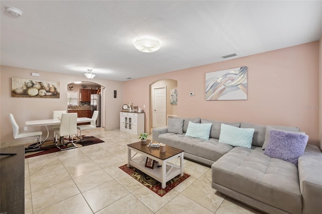 living room featuring a textured ceiling