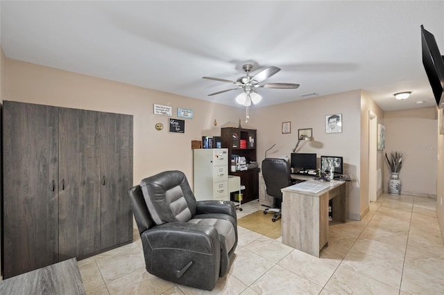 office featuring ceiling fan and light tile patterned floors