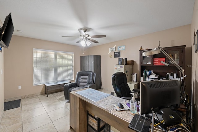 office featuring ceiling fan and light tile patterned floors