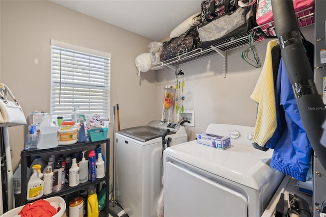 laundry room with washing machine and clothes dryer