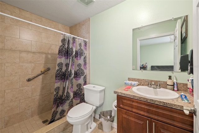 bathroom featuring a shower with curtain, vanity, and toilet