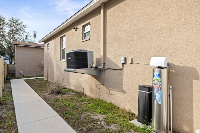 view of property exterior featuring central AC