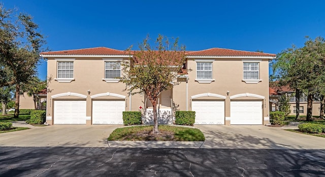 7107 Cedar Hollow Cir, Bradenton, FL 34203 - mediterranean / spanish-style home featuring a garage