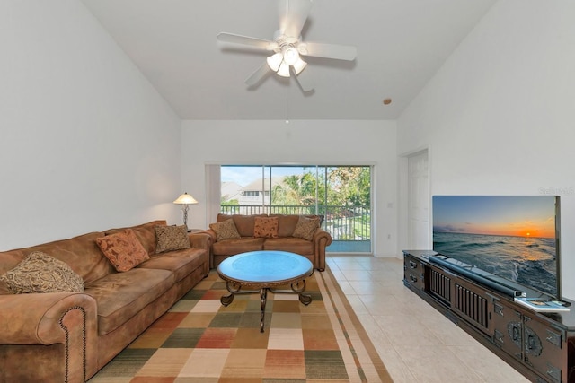 living room with ceiling fan and light tile patterned floors