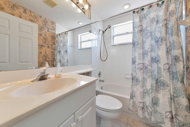 full bathroom featuring tile patterned flooring, vanity, shower / bath combination with curtain, and toilet