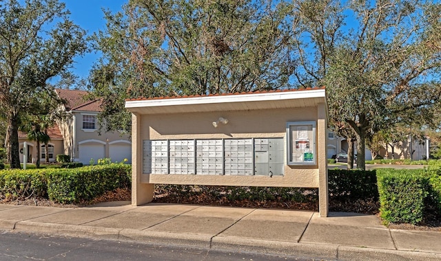 view of home's community featuring mail boxes